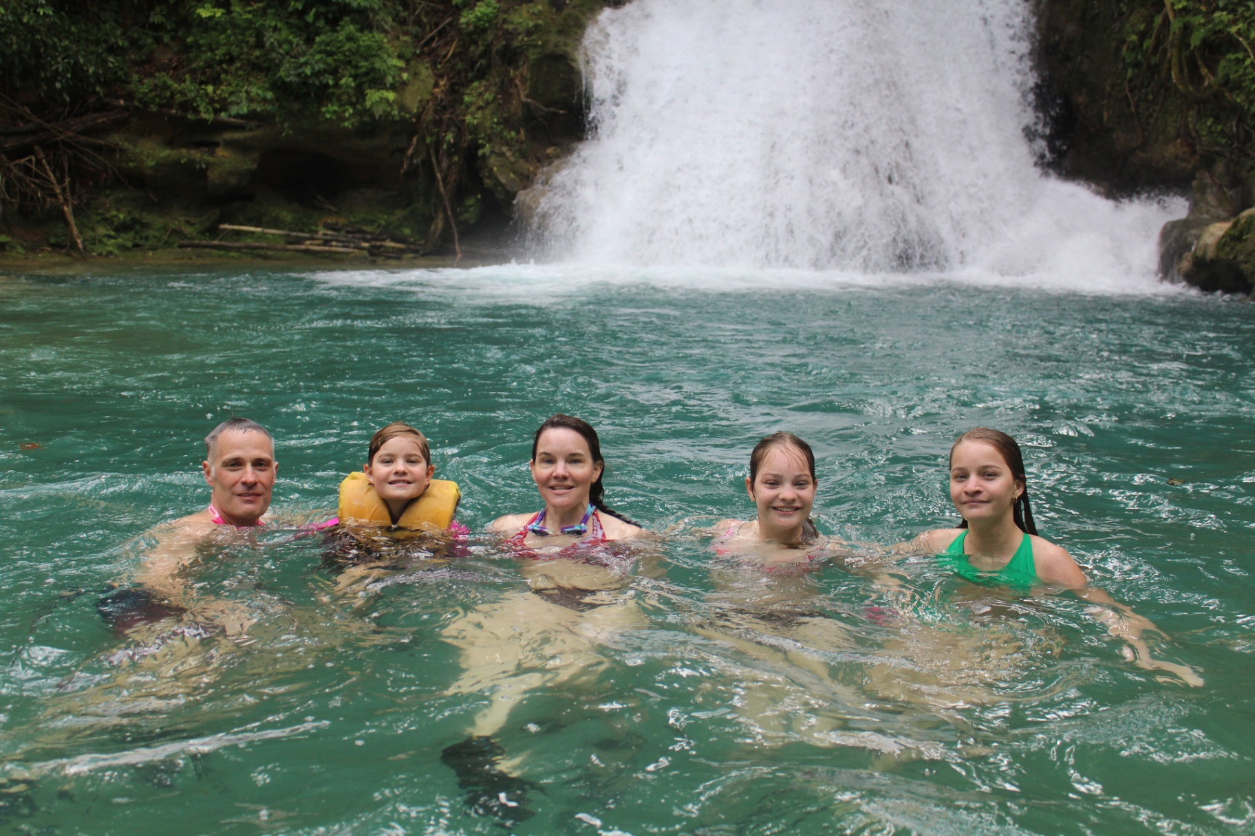 Guests swimming at Island Gully Falls Blue Hole Jamaica